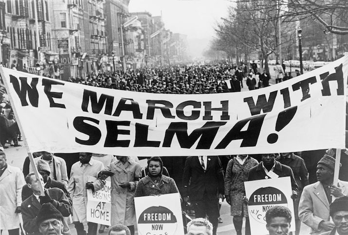 marchers carrying banner "We march with Selma!" on street in Harlem, New York City, New York, 15 March 1965