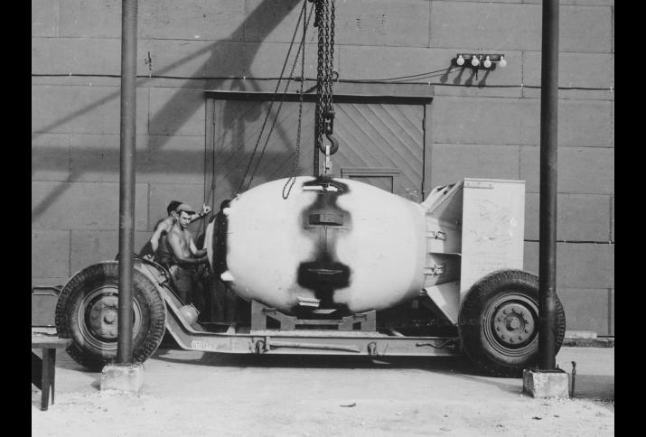 Fat Man unit being placed on trailer cradle in front of Assembly Building, August 1945.