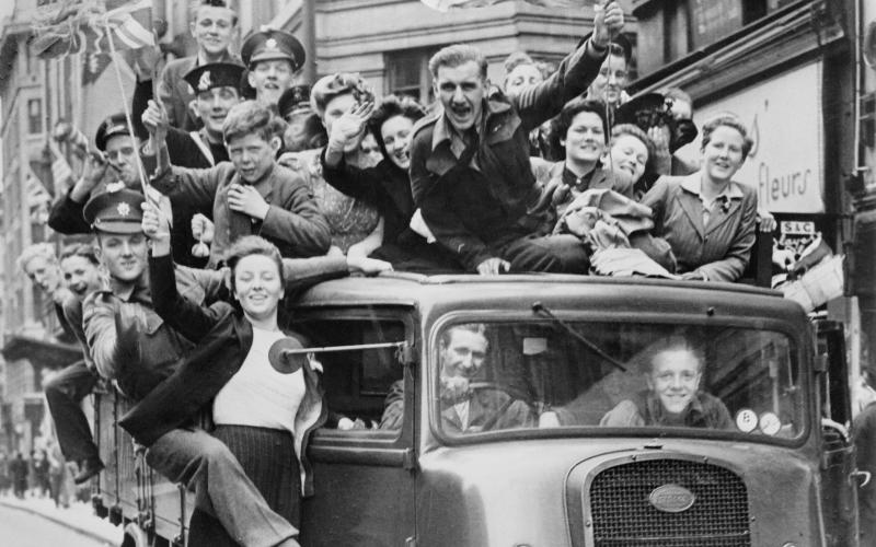 Ve Day Celebrations in London, 8 May 1945, A truck of revellers passing through the Strand, London
