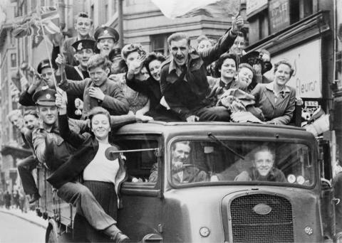 Ve Day Celebrations in London, 8 May 1945, A truck of revellers passing through the Strand, London