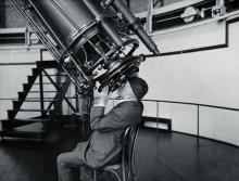 Professor Adolphus Hall of the U.S. Naval Observatory looking through the 26” telescope, August 18, 1924. Professor Adolphus Hall of the U.S. Naval Observatory looking through the 26” telescope, August 18, 1924.