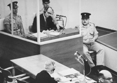 Adolf Eichmann takes notes during his trial Adolf Eichmann takes notes during his trial