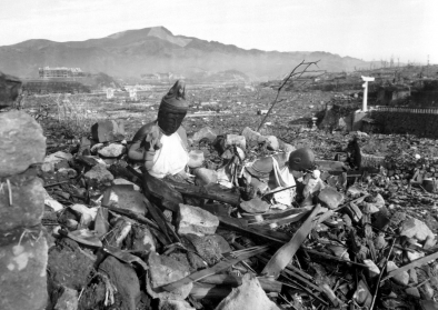 Battered religious figures stand watch on a hill above a tattered valley. Nagasaki, Japan. September 24,1945. Battered religious figures stand watch on a hill above a tattered valley. Nagasaki, Japan. September 24,1945.