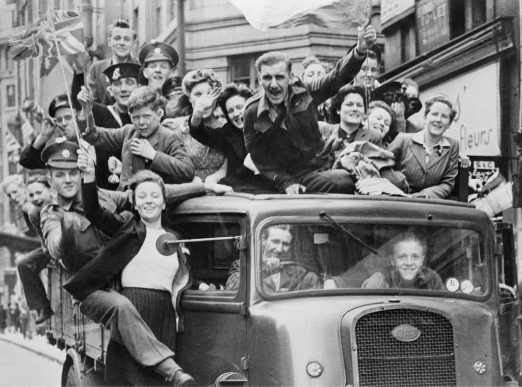 Ve Day Celebrations in London, 8 May 1945, A truck of revellers passing through the Strand, London