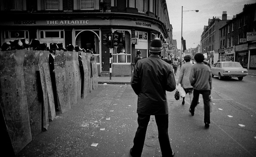 During the 1981 Brixton riot in London, police with riot shields line up on a corner in Brixton, 11 April 1981. 