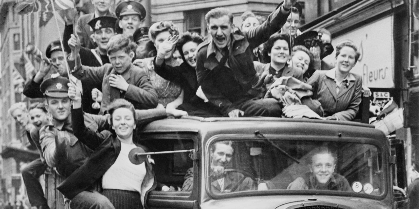 Ve Day Celebrations in London, 8 May 1945, A truck of revellers passing through the Strand, London
