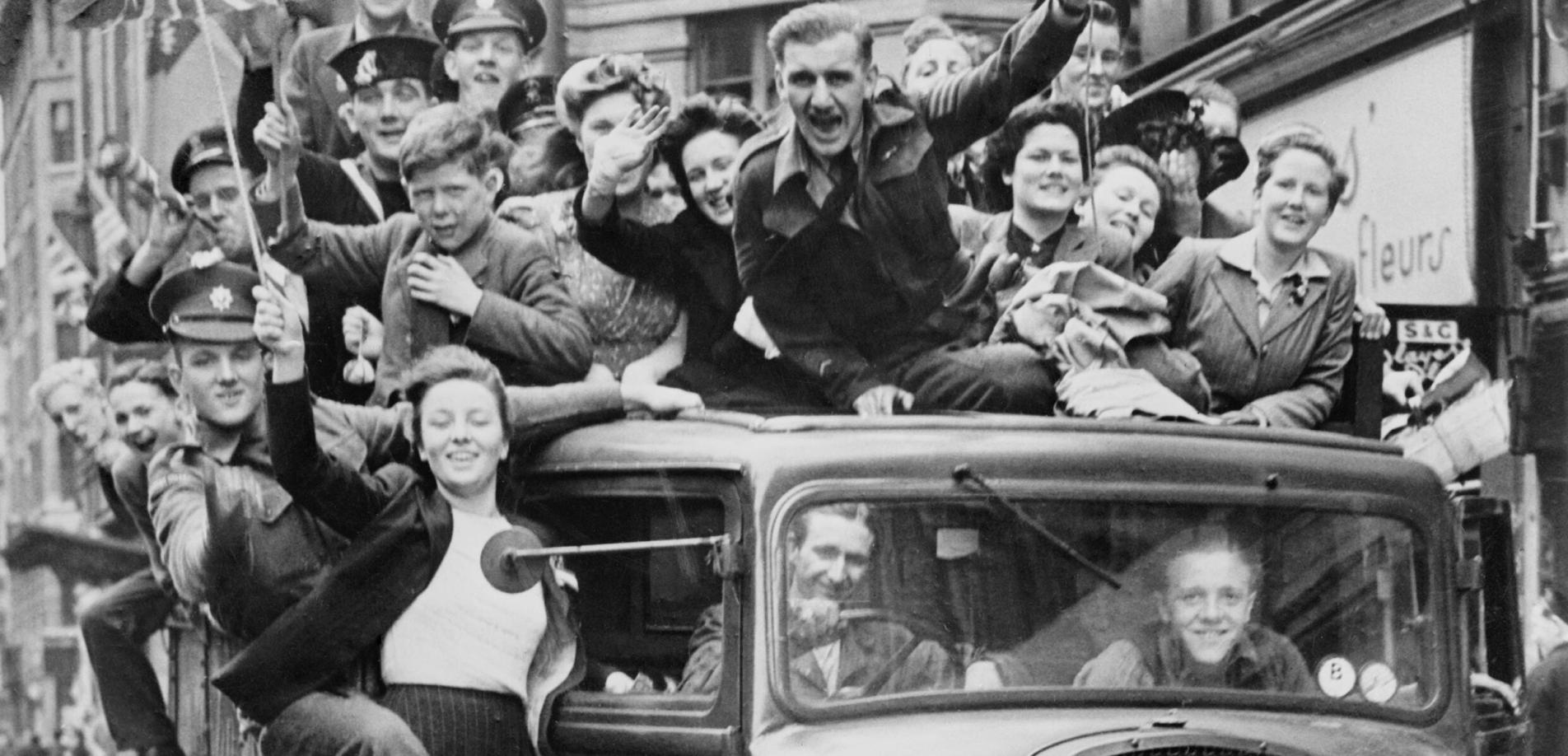 Ve Day Celebrations in London, 8 May 1945, A truck of revellers passing through the Strand, London