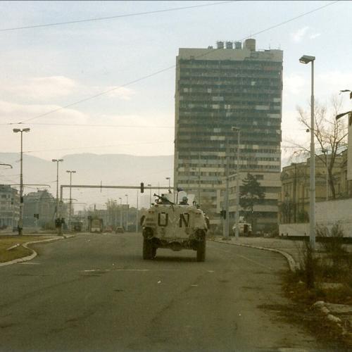 Norwegian Sisu from NORLOGBAT APC at "Sniper Alley" in Sarajevo, December 1995, Paalso, 1995, wikimedia Commons, Public Domain.