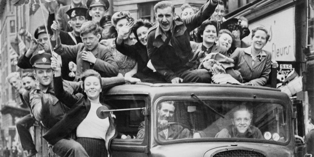 Ve Day Celebrations in London, 8 May 1945, A truck of revellers passing through the Strand, London