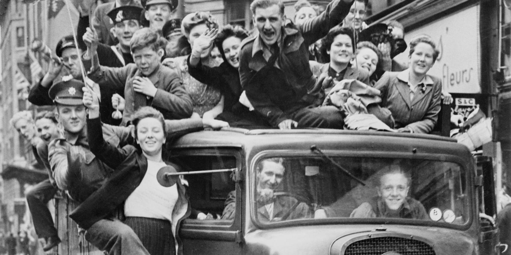 Ve Day Celebrations in London, 8 May 1945, A truck of revellers passing through the Strand, London