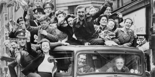 Ve Day Celebrations in London, 8 May 1945, A truck of revellers passing through the Strand, London