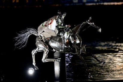 The Horsewoman, wearing the Flag of the International Olympic Committee (IOC)