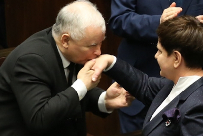 Jarosław Kaczyński kissing Beata Szydło's hand after her expose in Sejm