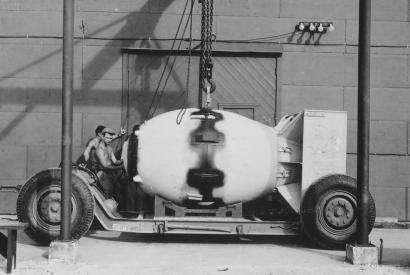 Fat Man unit being placed on trailer cradle in front of Assembly Building, August 1945.
